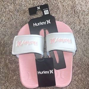 Hurley pink and white youth slides.